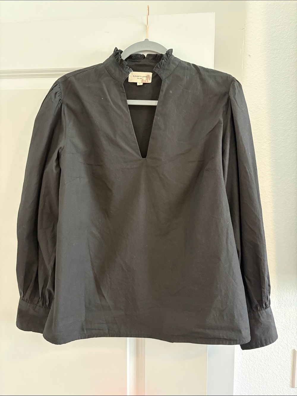 Ruffle-Trim Black V-Notch Long Sleeve Blouse